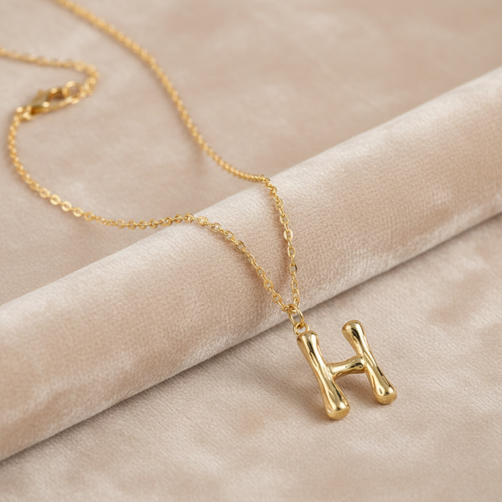 Gold Letter H on Champagne Velvet