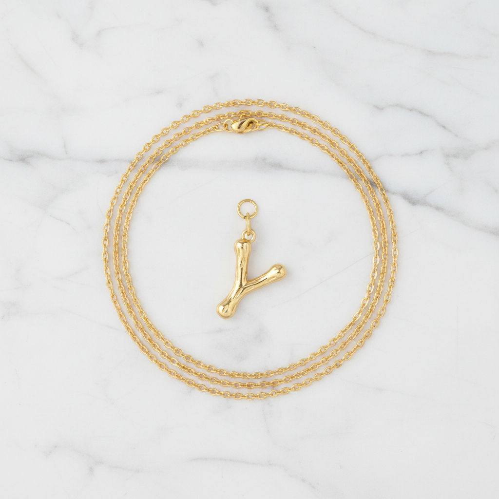 Gold Letter L on White Marble