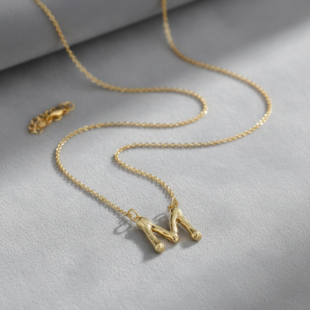 Gold Letter M on Grey Velvet