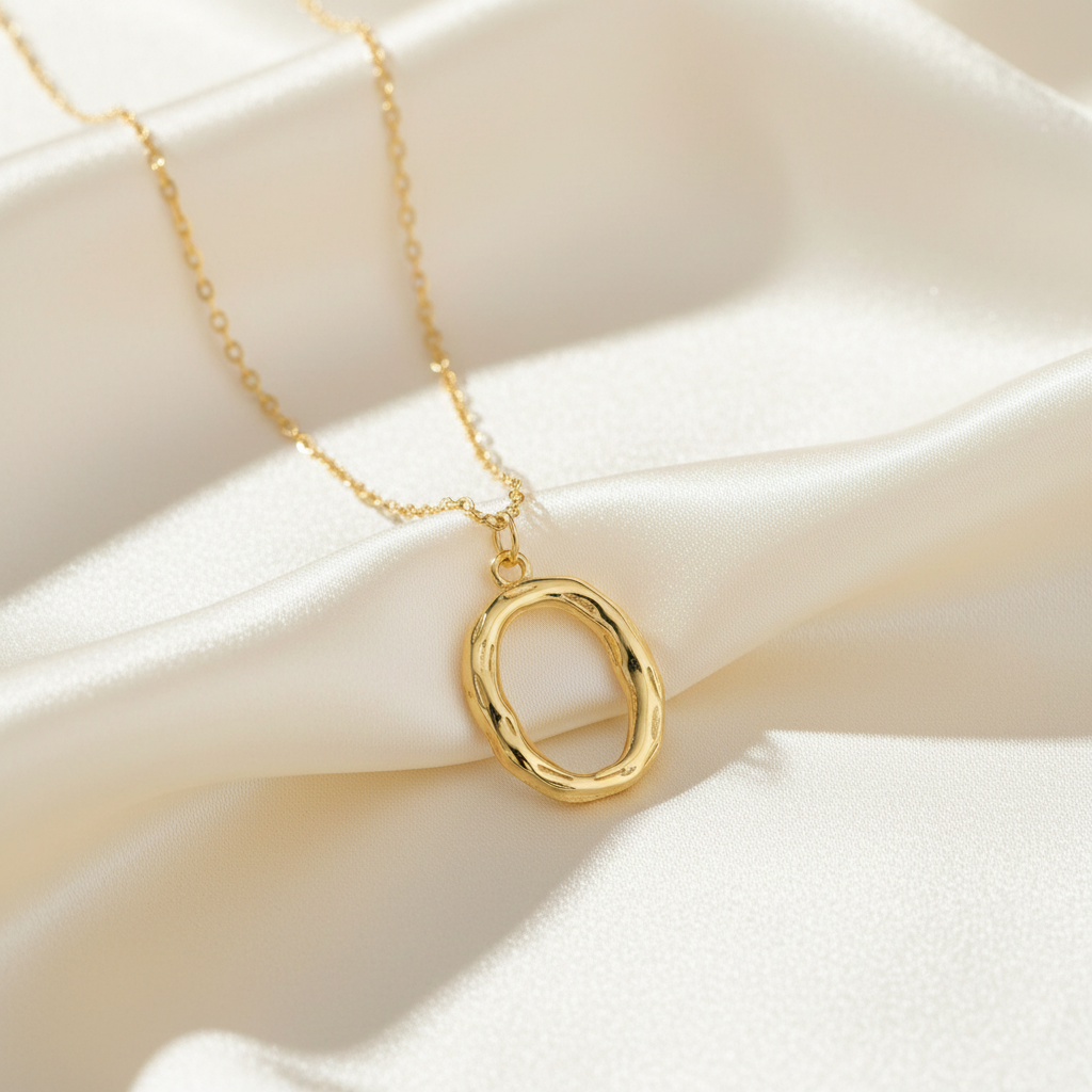 Gold Letter O on Cream Silk