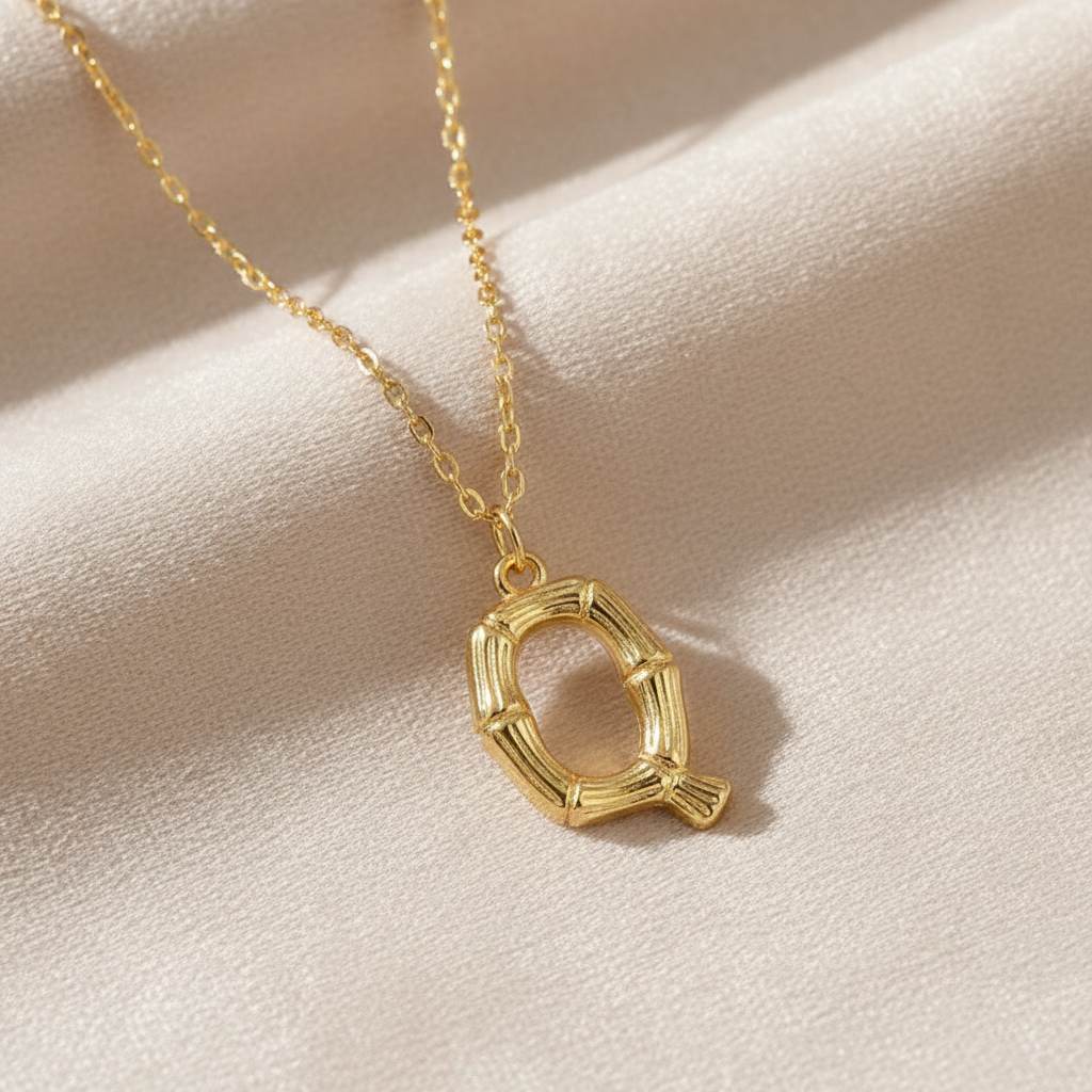 Gold Letter Q on Champagne Velvet