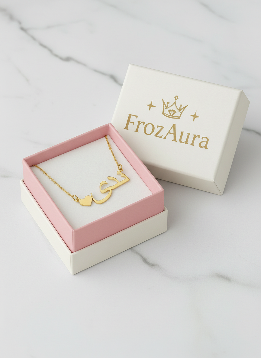 Gold necklace in FrozAura box on marble