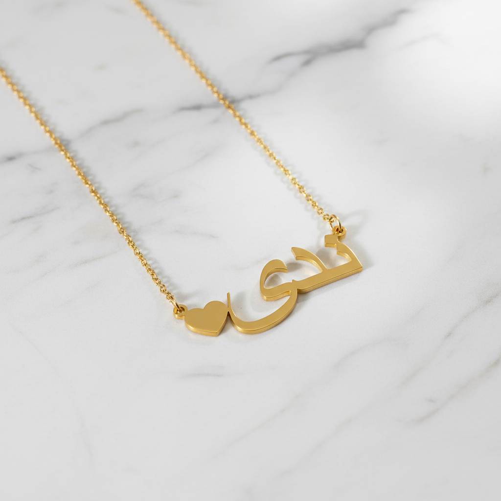 Gold necklace on white marble