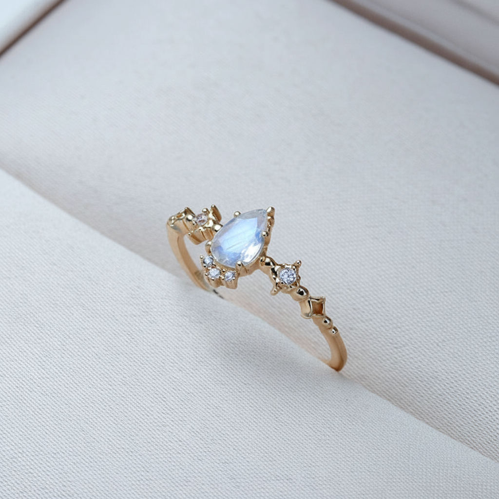 Gold Pear Moonstone Ring on White Linen
