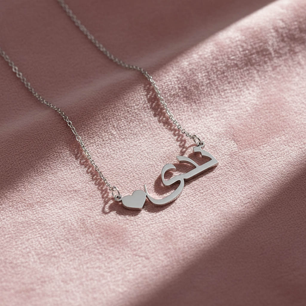 Silver necklace on pink velvet